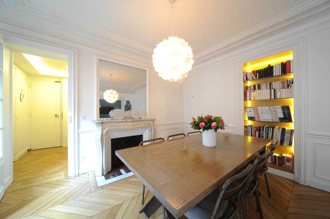 Agrandissement d'une salle de séjour dans un appartement à Paris - Photo après les travaux de rénovation